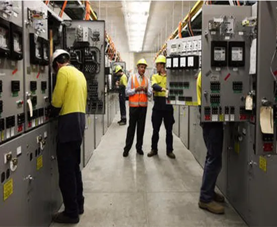 Engineers inspecting a switchgear room