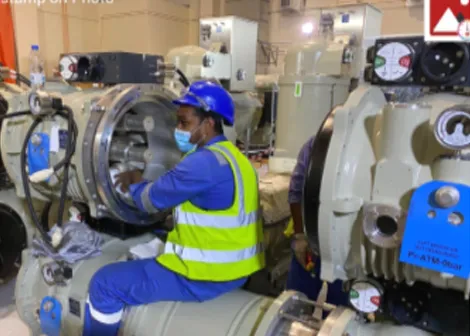 Technician working on gas-insulated switchgear