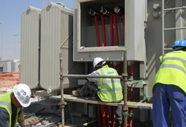Transformer radiator bank and cable terminations being worked on
